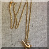 J18. 14K Gold chain with karate pendant. - $225